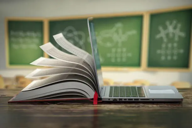 computer with a textbook